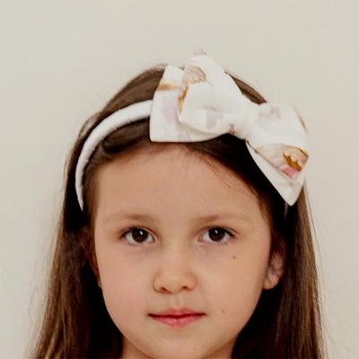 Picture of PRE ORDER Daga Girls Twinkle Flight Fabric Bow Hairband - White Beige
