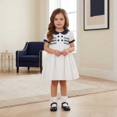 Picture of Sarah Louise Girls Smocked Bodice Puff Sleeve Button Dress - White Navy